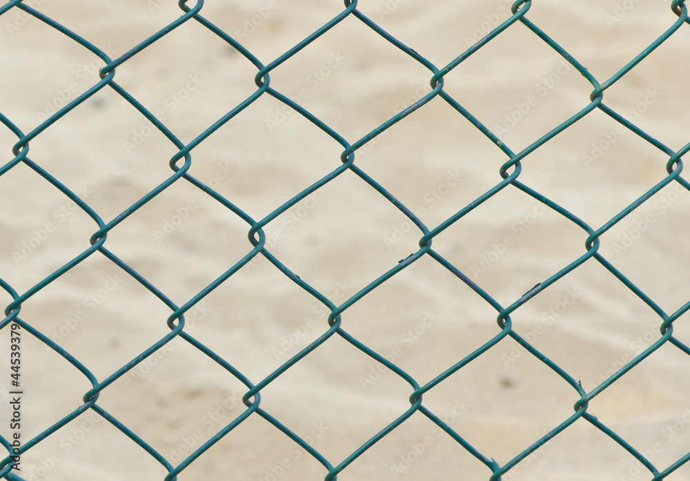 Fototapeta premium green seamless fence chain on sand background