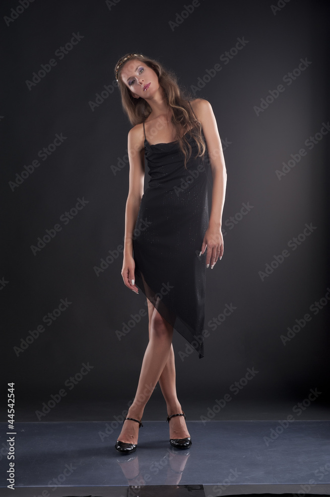 A young woman in a black dress