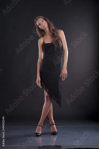 A young woman in a black dress