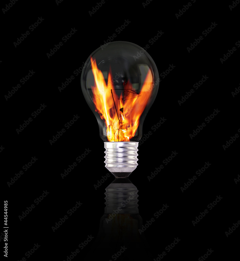 light bulb with fire on black background