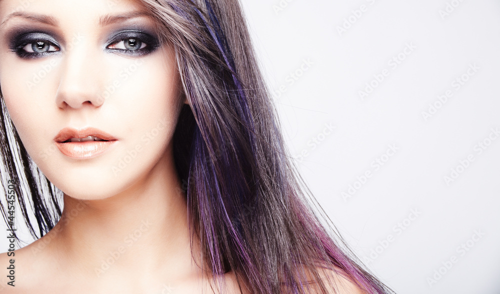 Fototapeta premium beautiful woman with long colored brown hair and bright makeup