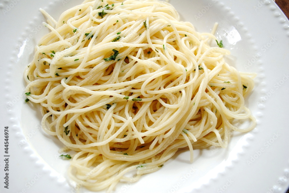 Spaghetti with Butter and Parsley on a White Plate