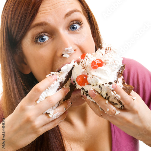 Cheerful woman eating pie, over white