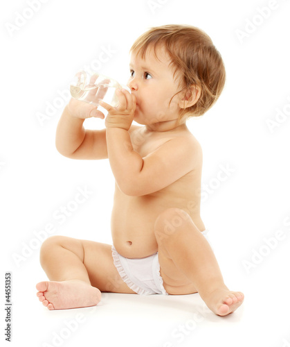 Cute baby drinking isolated...