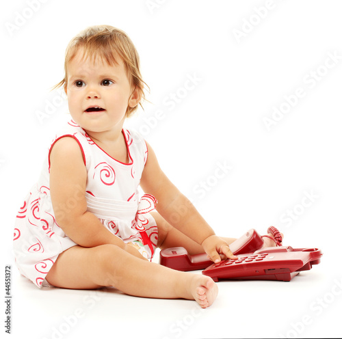 Cute baby with telephone is...