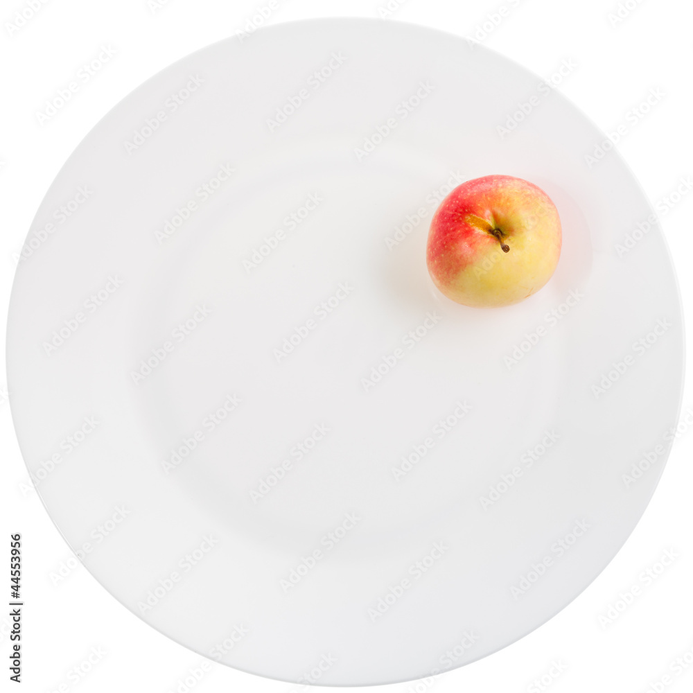 yellow red apple on white plate yellow red apple on white plate