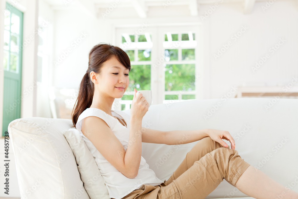 Beautiful young woman relaxing in the room. Portrait of asian. Beautiful young woman relaxing in the room. Portrait of asian.