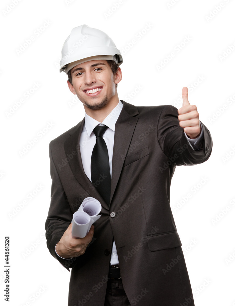 Engineer in white hard hat and keeping drafts thumbs up Engineer in white hard hat and keeping drafts thumbs up