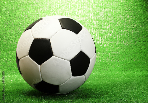 football ball on artificial green grass