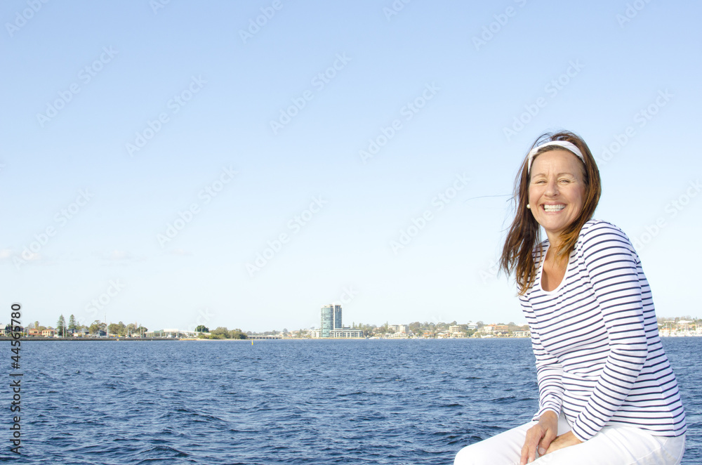 Active happy retired woman sky background