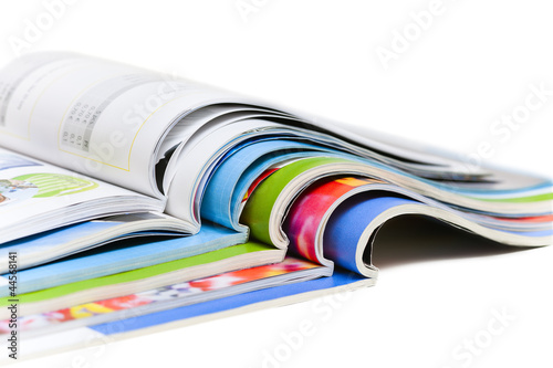 Color magazines isolated on the white background photo