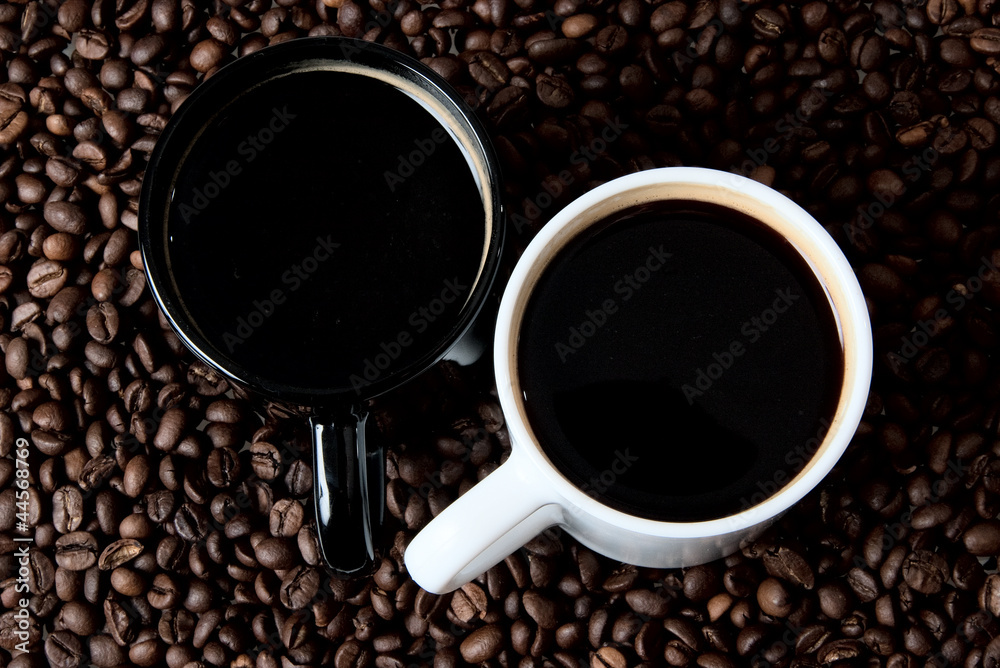 Fototapeta premium Two coffe mugs on coffe beans