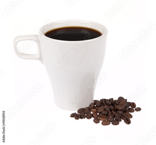 Coffee cup with coffee beans isolated on white