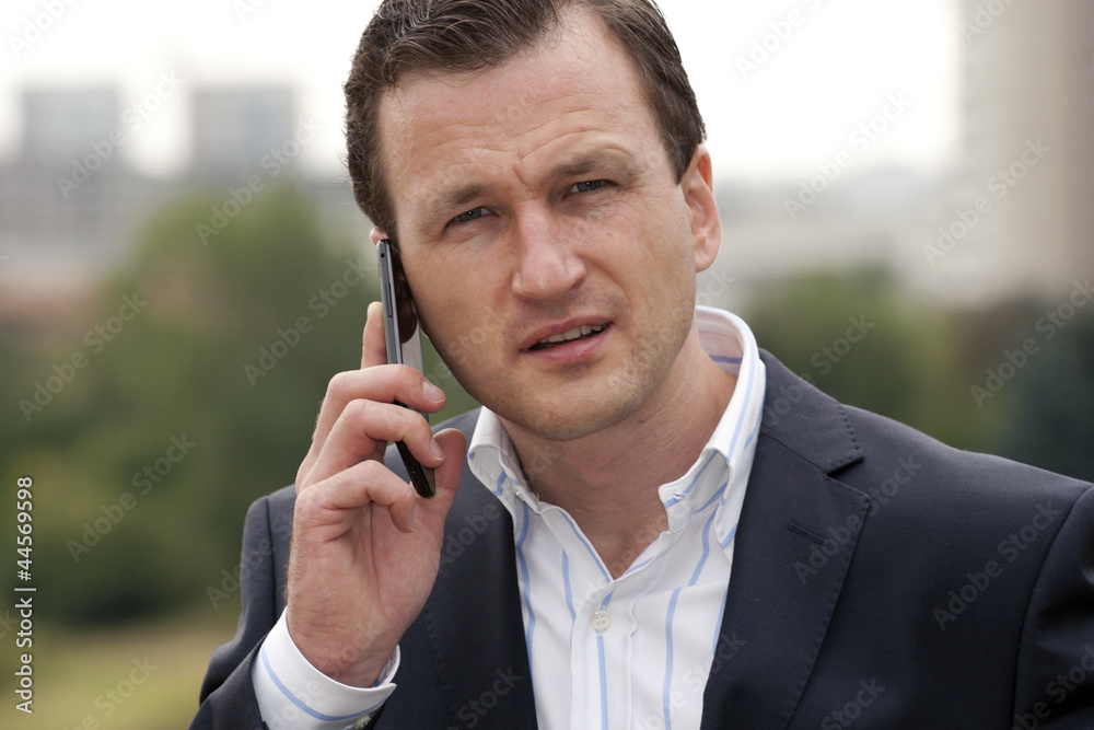 Businessman having conversation on mobile phone Businessman having conversation on mobile phone