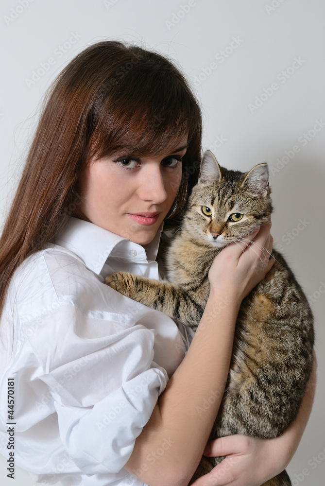 Girl with a cat in her arms