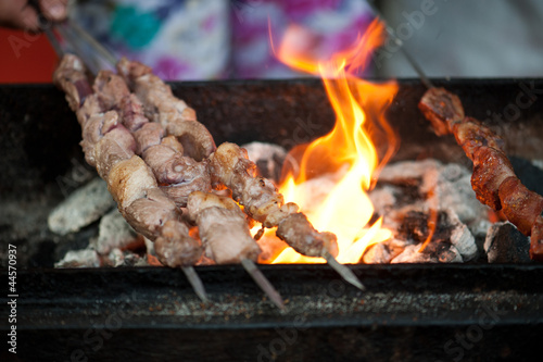 Flames grilling skewers at a market in Xian  China