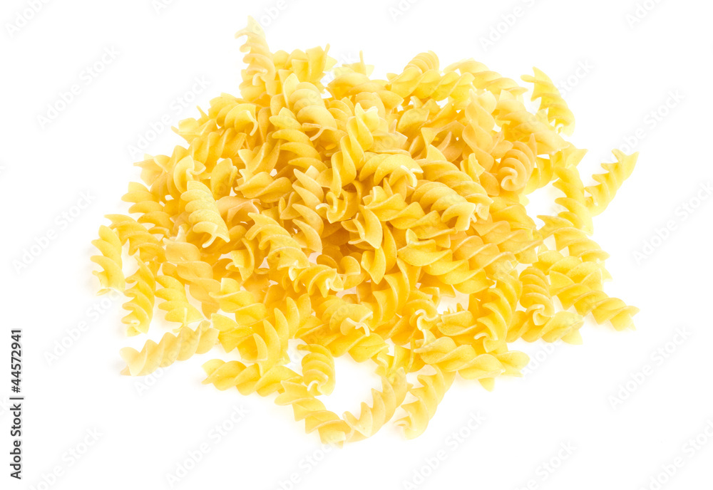 A portion of Rotini corkscrew pasta isolated on white. A portion of Rotini corkscrew pasta isolated on white.