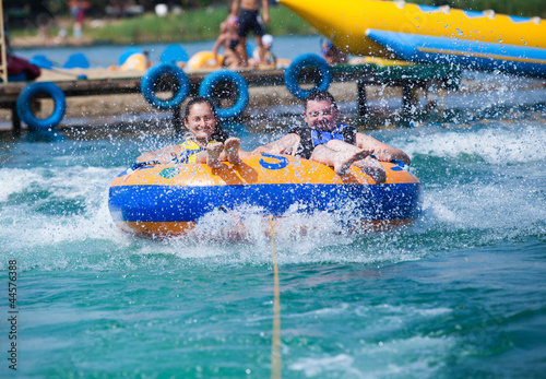 Young couiple on water attractions during summer vacations photo