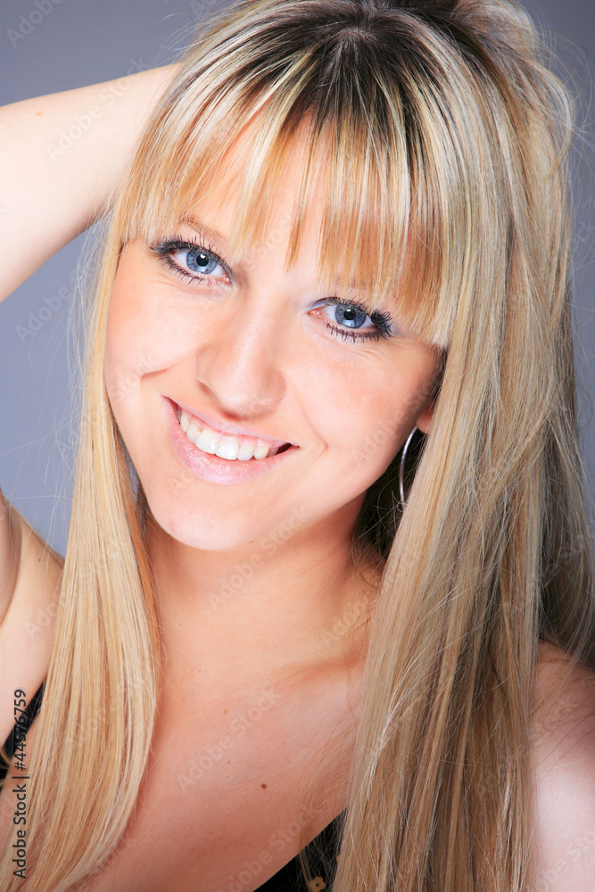 woman portrait over a gray background woman portrait over a gray background