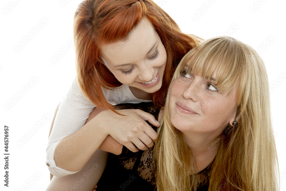 young beautiful red and blond haired girls piggypack young beautiful red and blond haired girls piggypack