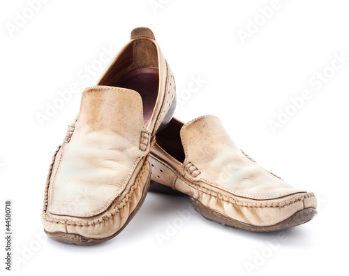 Pair of brown male loafers isolated on white