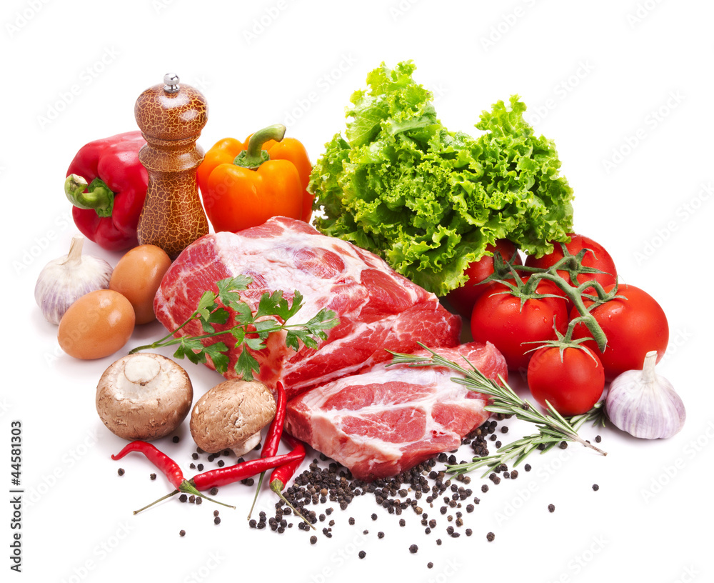 Still life with raw pork meat and fresh vegetables