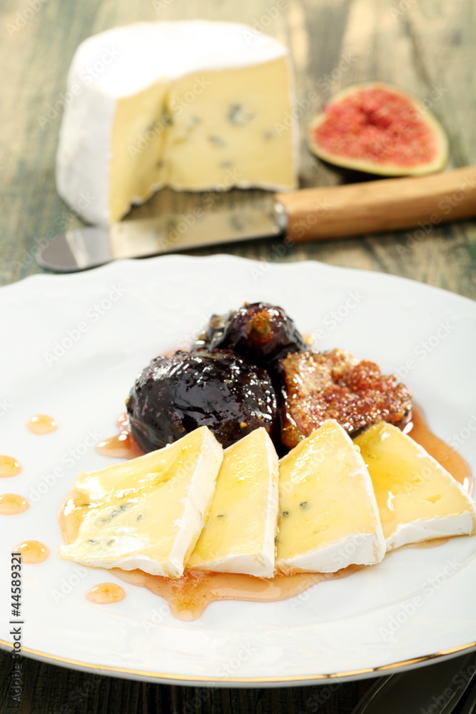 Figs cooked in honey and soft cheese.