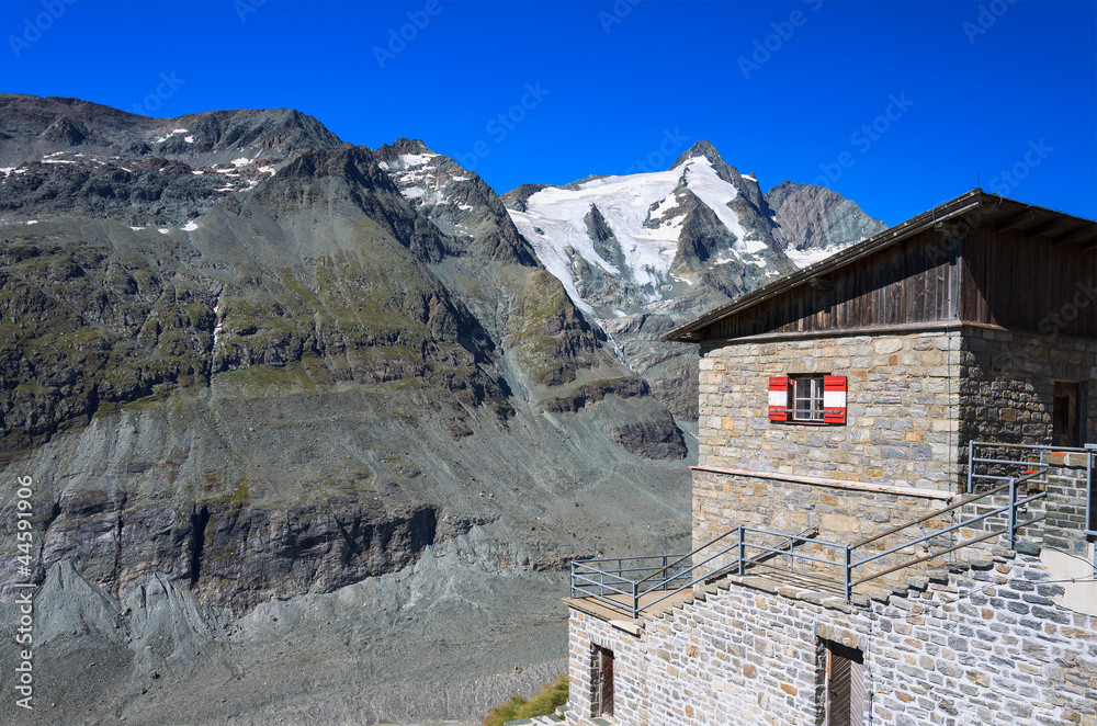 Traditional alpine hut with Grossglockner mountain view, Austria