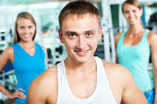 Fitness instructor with gym people