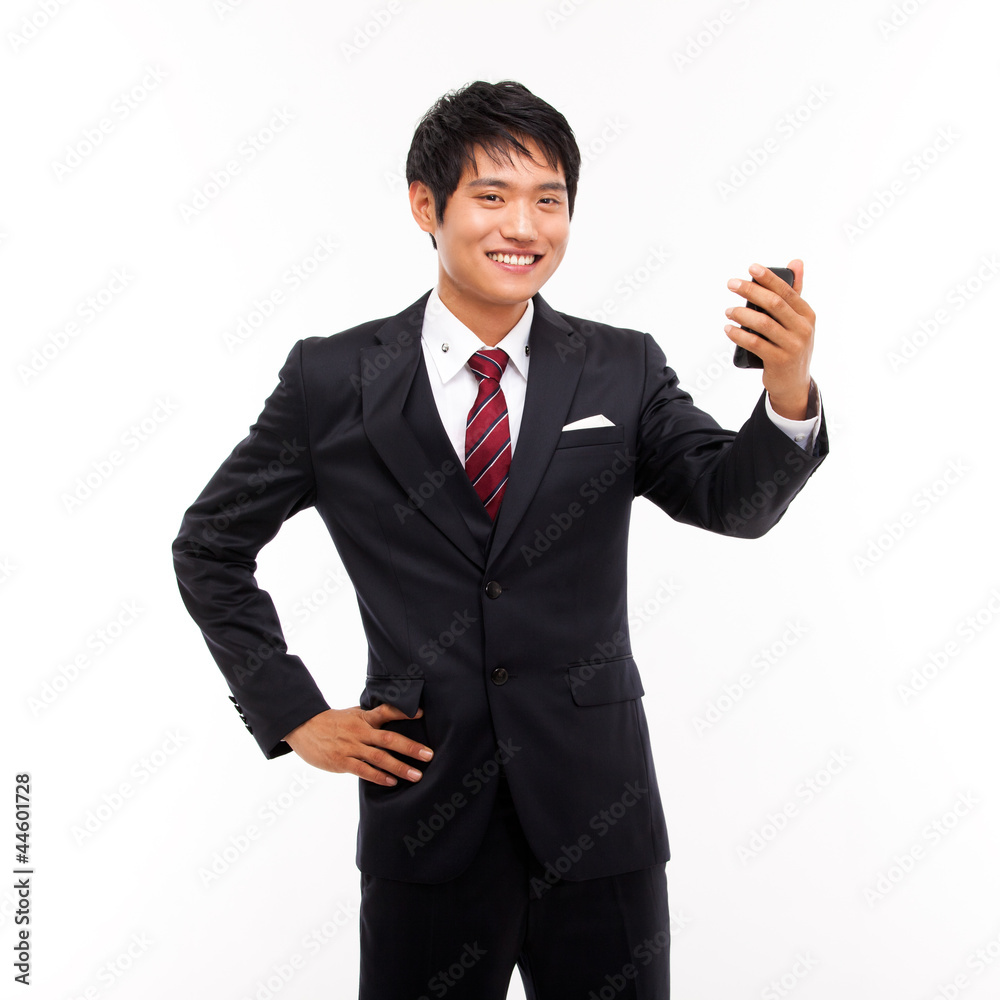 Asian business man with cellphone isolated on white background. Asian business man with cellphone isolated on white background.