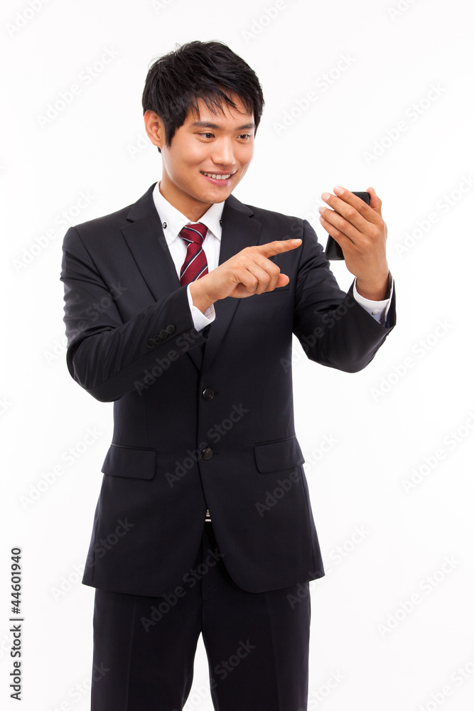 Asian business man with cellphone isolated on white background.