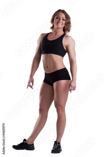 Strong woman full height body builder isolated