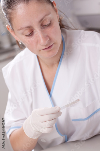 Woman preparing sample glass