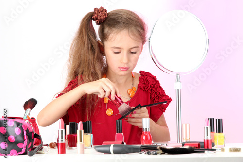 little girl in her mother's...