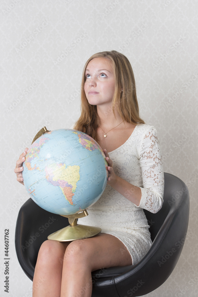 Young woman holding a terrestrial globe Young woman holding a terrestrial globe