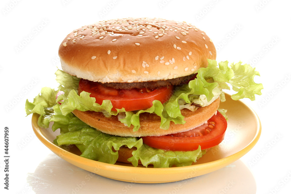 Big and tasty hamburger on plate isolated on white Big and tasty hamburger on plate isolated on white