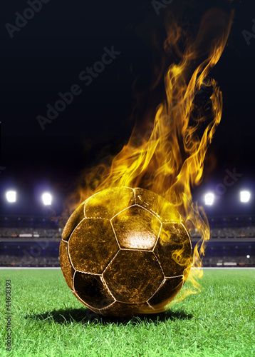 Fotografía fiery soccer ball on field