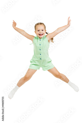 happy child girl jumping isolated on white
