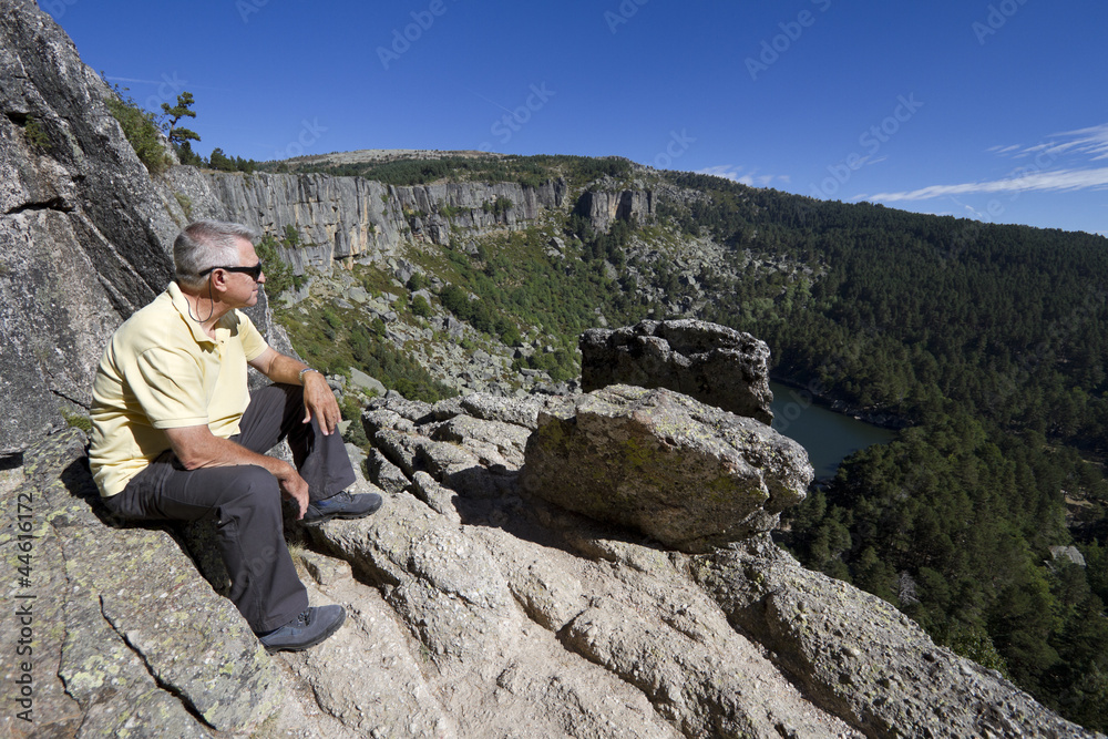 Senior man sitting and looking at view