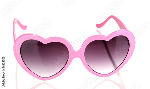 Pink heart-shaped sunglasses isolated on white