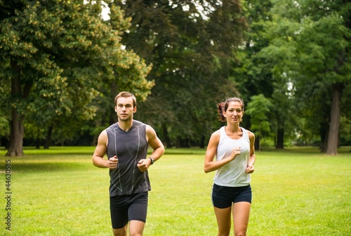 Fototapeta Naklejka Na Ścianę i Meble -  Jogging together - young couple running