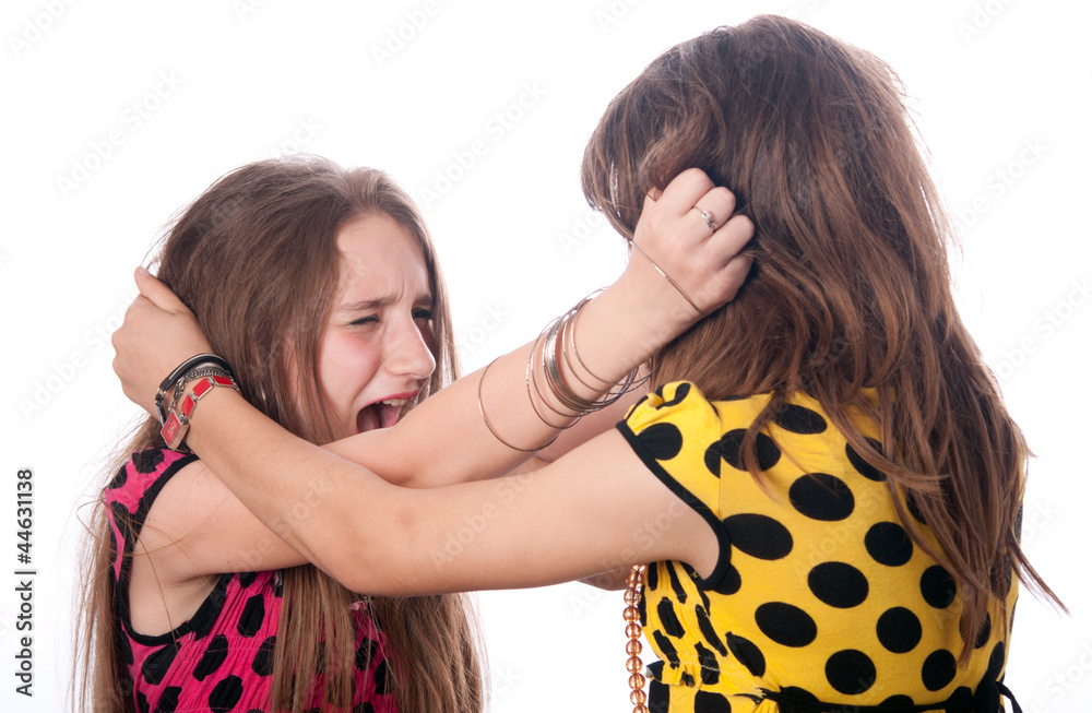 Foto de Two teenage girls pulling each others hair do Stock
