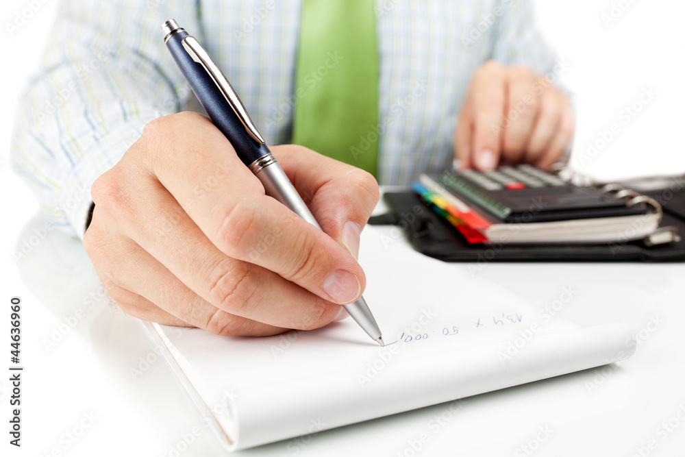 Businessman counting on calculator. Businessman counting on calculator.