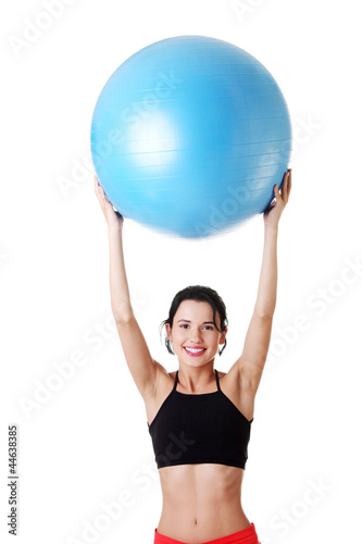 Young healthy lifestyle woman with pilates exercise ball.