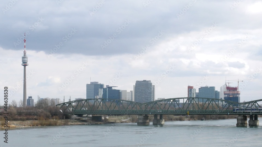 Trains go on railway bridge through river Danube Trains go on railway bridge through river Danube