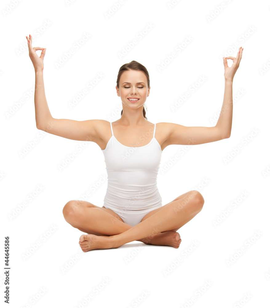 woman in undrewear practicing yoga lotus pose woman in undrewear practicing yoga lotus pose