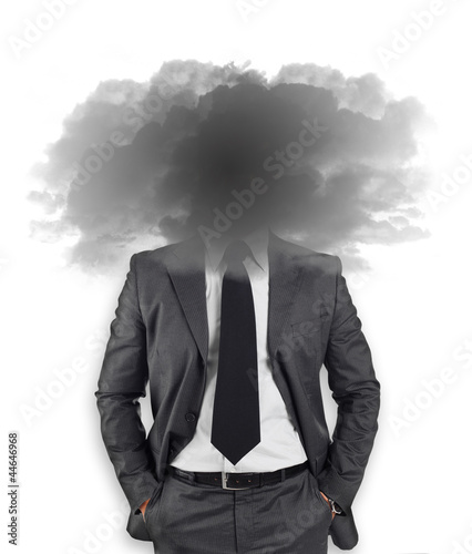 Businessman - head in the black clouds photo