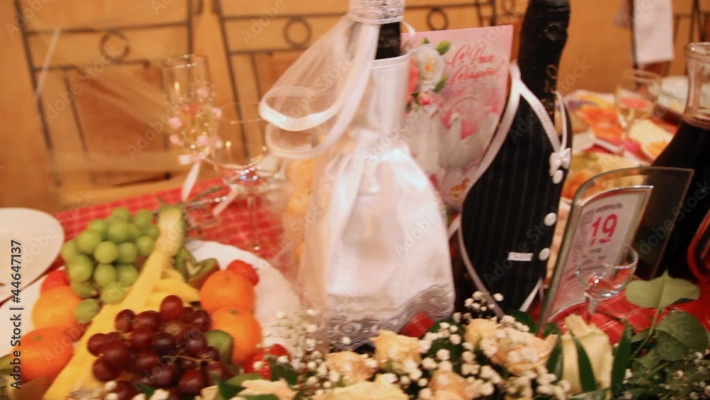 Wedding festive table with champagne fruit flowers Wedding festive table with champagne fruit flowers