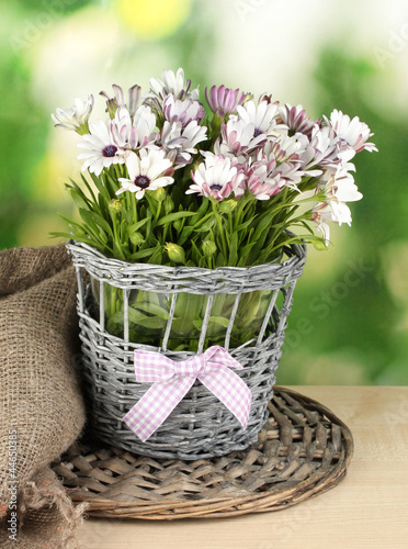 Fototapeta Naklejka Na Ścianę i Meble -  bouquet of beautiful summer flowers in wicker vase,
