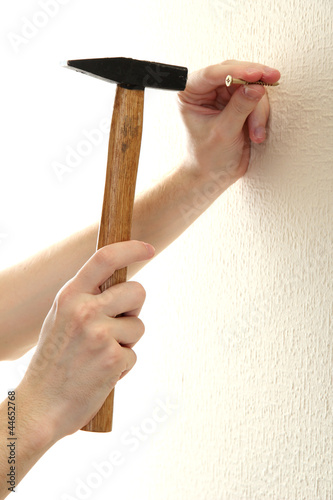 man hands with nail and hammer